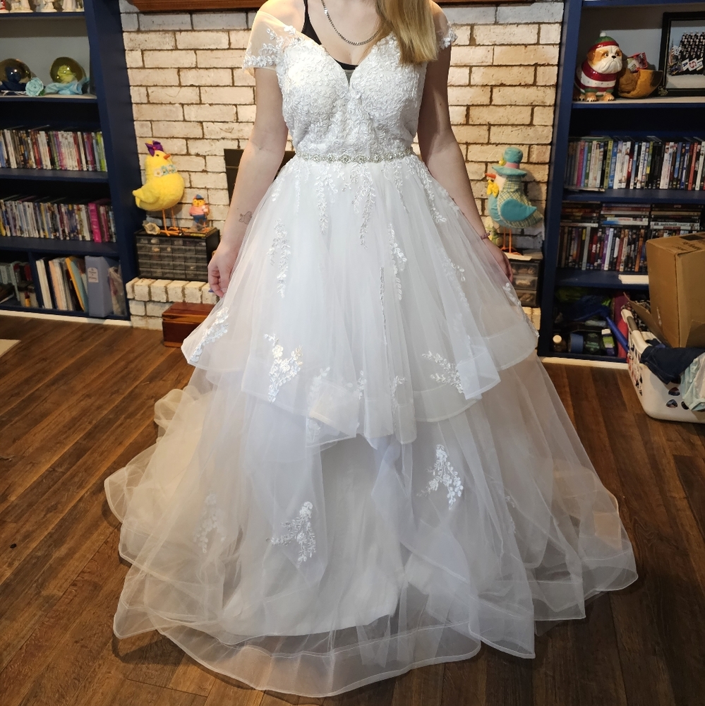 Lace and tulle wedding gown with belt